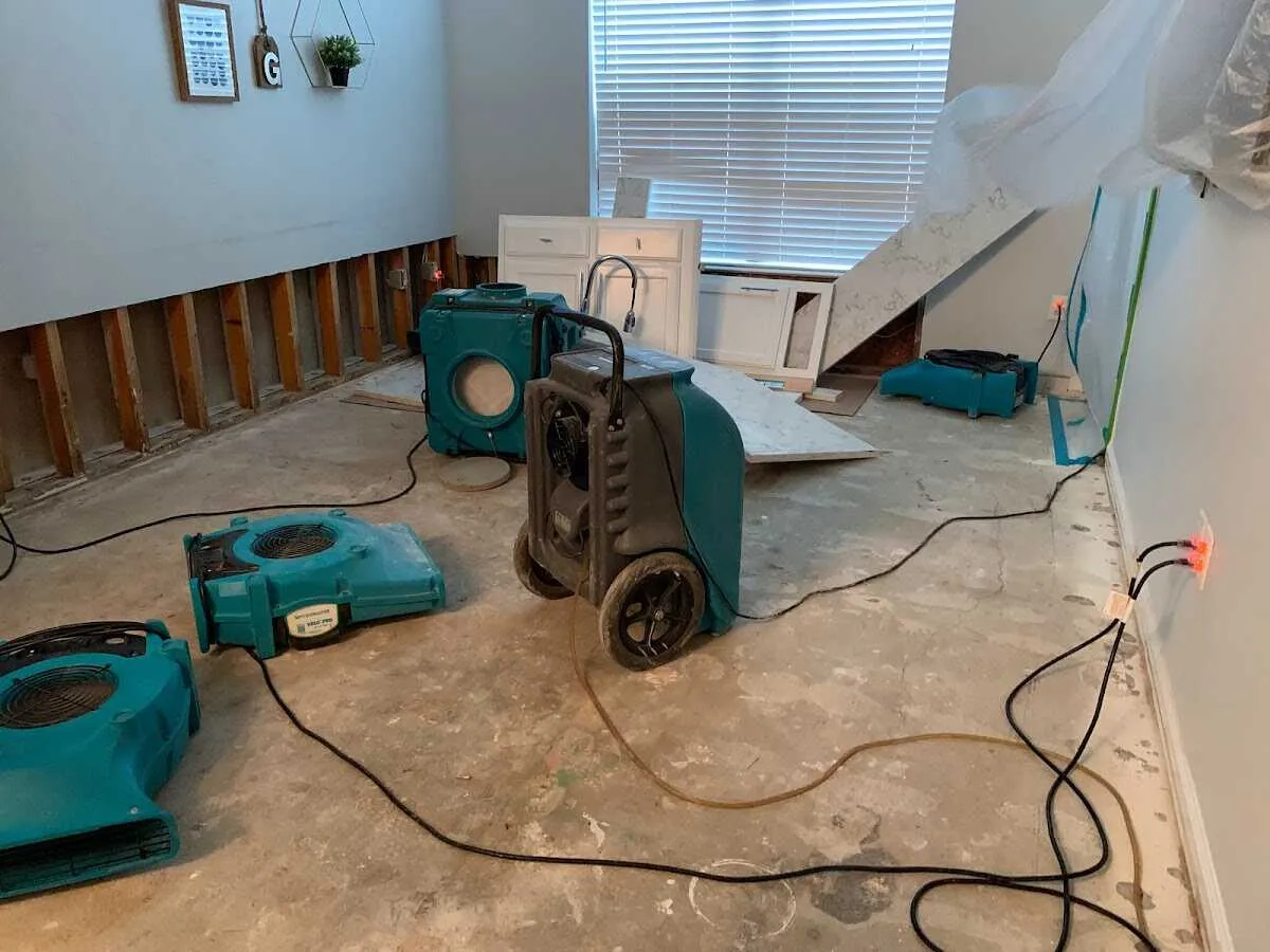 Dehumidifier in flood-cut room for Water Damage Restoration in Harvard